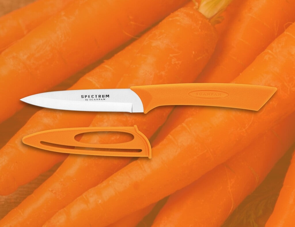 Spectrum vegetable knife in Carrot Curl on a white background
