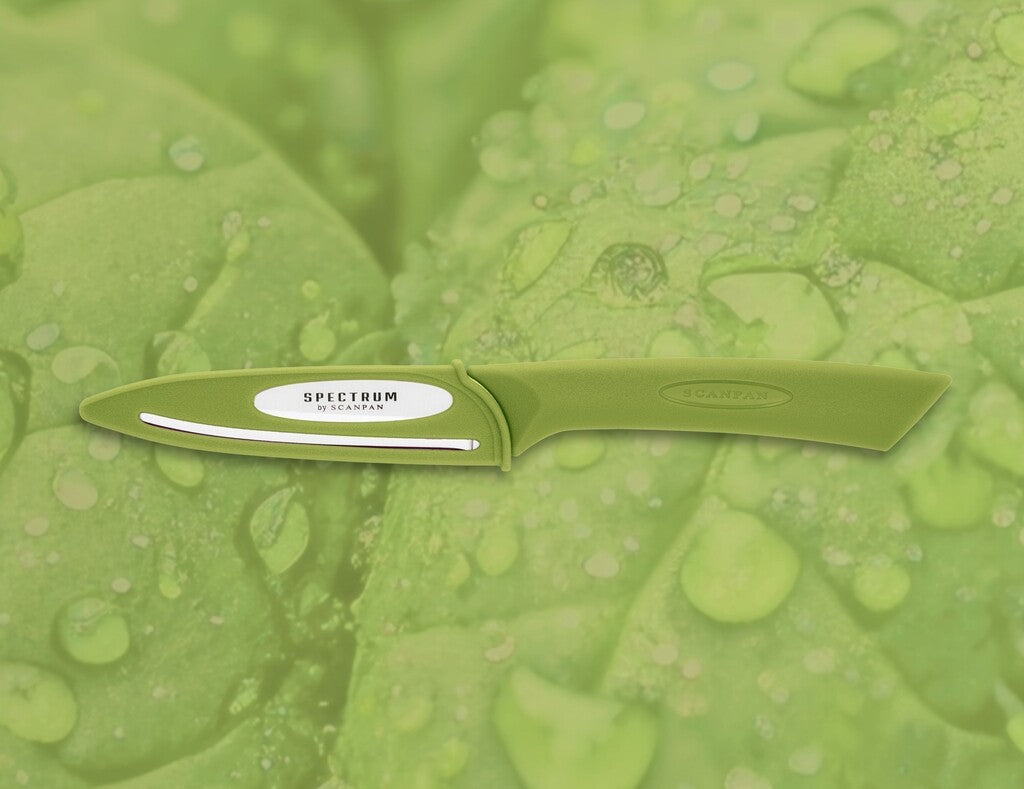 Spectrum vegetable knife in Spinach Green shown in use