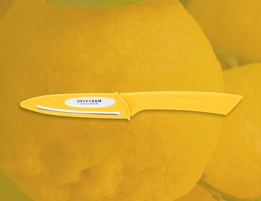 Spectrum vegetable knife in Sunstruck shown in use