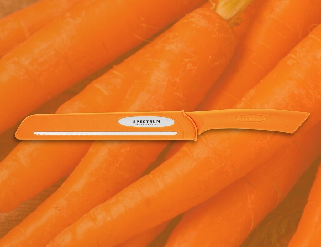 Spectrum bread knife in Carrot Curl shown in use