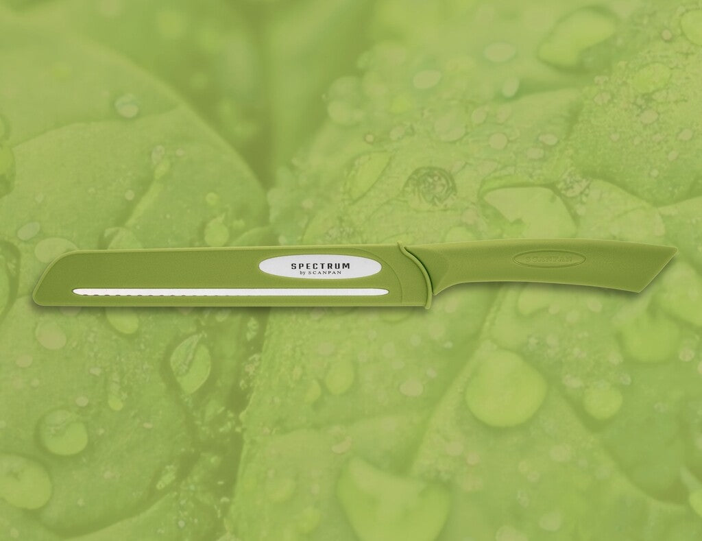 Spectrum bread knife in Spinach Green shown in use